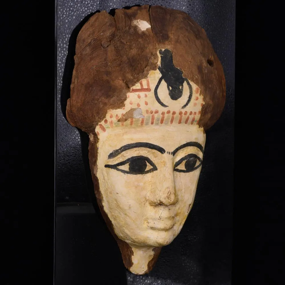 An Egyptian Wooden Mummy Mask, 21st Dynasty, ca. 1069 - 945 BCE